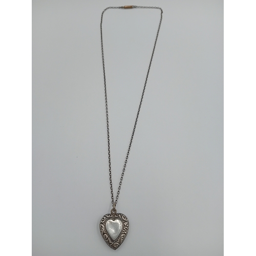 361 - A vintage stamped silver heart pendant on a white metal chain.