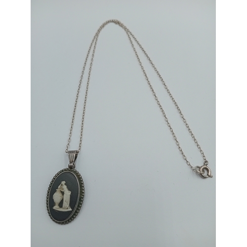 362 - A vintage wedgewood black jasperware pendant with a stamped Sterling Silver chain.