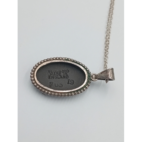 362 - A vintage wedgewood black jasperware pendant with a stamped Sterling Silver chain.