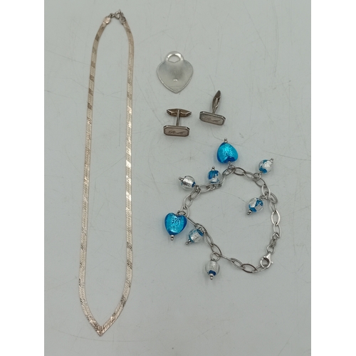 364 - A collection of silver items. To include; a vintage stamped 925 herringbone necklace, a stamped 925 ... 