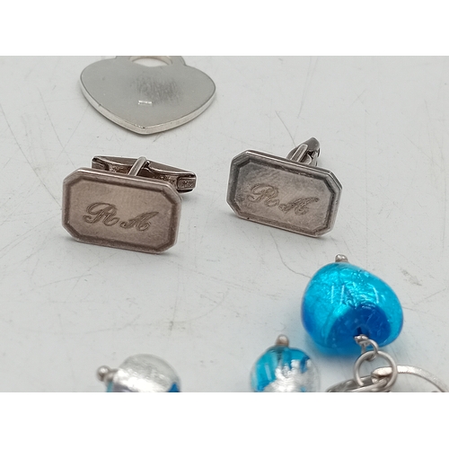364 - A collection of silver items. To include; a vintage stamped 925 herringbone necklace, a stamped 925 ... 