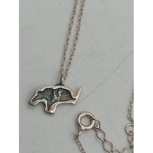 365 - Two silver necklaces. One has a stamped 925 elephant pendant and the other has a stamped 925 crucifi... 