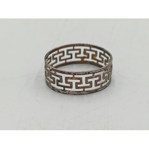 367 - A collection of 3 silver rings. To include a dolphin ring, greek key design ring and a chevron ring.