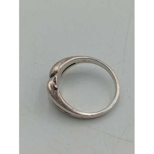 367 - A collection of 3 silver rings. To include a dolphin ring, greek key design ring and a chevron ring.