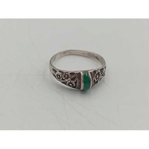 368 - A collection of 3 stamped 925 silver rings. One has a floral design with a green stone, one is a cha... 