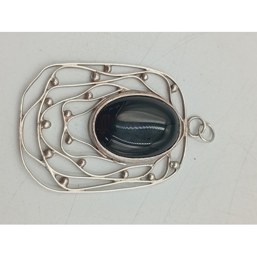 369 - A vintage stamped 925 silver bangle set with colourful stones and a hallmarked silver pendant with a... 