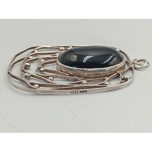 369 - A vintage stamped 925 silver bangle set with colourful stones and a hallmarked silver pendant with a... 