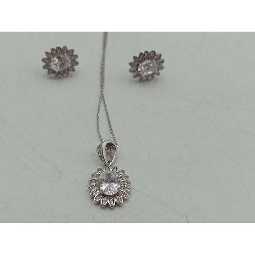 372 - A stamped 925 silver necklace and earring set. Chain is tangled.