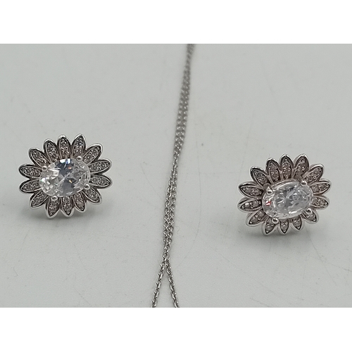 372 - A stamped 925 silver necklace and earring set. Chain is tangled.