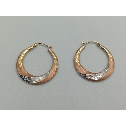 374 - A pair of stamped 9k gold hoop earrings.