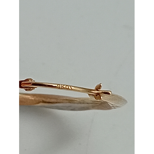 374 - A pair of stamped 9k gold hoop earrings.
