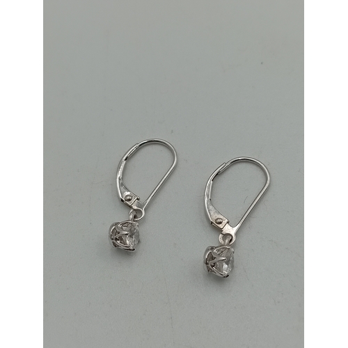 375 - A pair of stamped 585 14ct white gold earrings set with CZ.