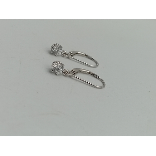 375 - A pair of stamped 585 14ct white gold earrings set with CZ.