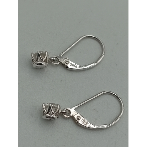 375 - A pair of stamped 585 14ct white gold earrings set with CZ.