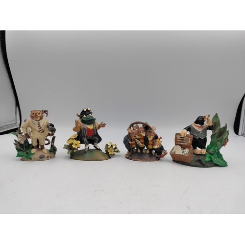 167 - A set of 4 lead The wind in the willows figures. To include Mr. Toad, Ratty, Mr. Mole & Caroling mic... 