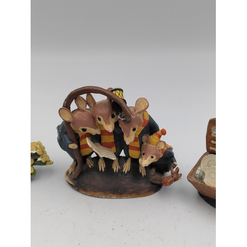 167 - A set of 4 lead The wind in the willows figures. To include Mr. Toad, Ratty, Mr. Mole & Caroling mic... 