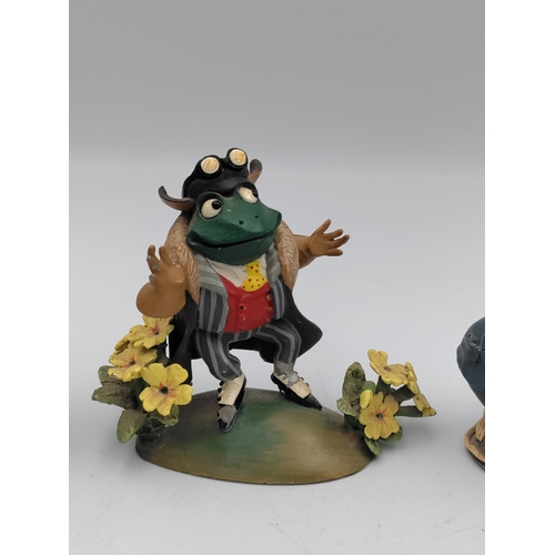 167 - A set of 4 lead The wind in the willows figures. To include Mr. Toad, Ratty, Mr. Mole & Caroling mic... 