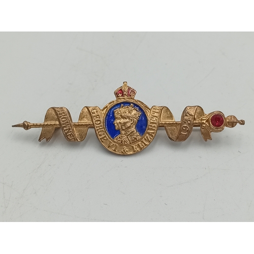 381 - A hallmarked silver locket on a stamped Sterling chain and a 1937 coronation brooch pin.