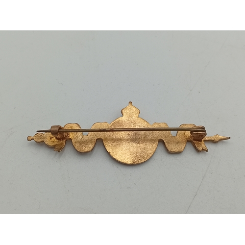 381 - A hallmarked silver locket on a stamped Sterling chain and a 1937 coronation brooch pin.