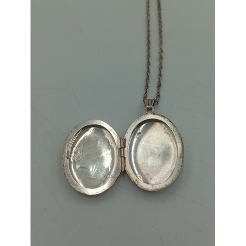 381 - A hallmarked silver locket on a stamped Sterling chain and a 1937 coronation brooch pin.