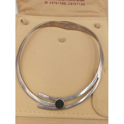 383 - A stamped Mexico silver hinged necklace set with a black stone.