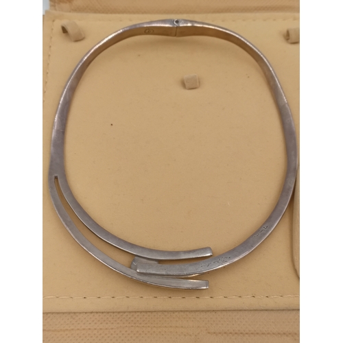 383 - A stamped Mexico silver hinged necklace set with a black stone.