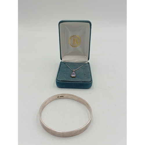 386 - A stamped 925 silver necklace with a stamped 925 silver pendant with purple inlay and a hallmarked s... 