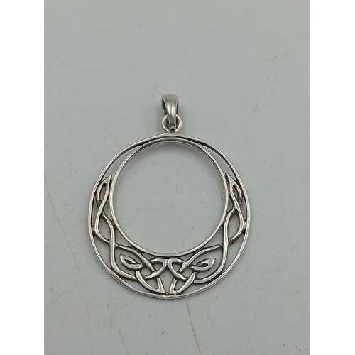388 - A sherwood crystal jewellery thistle pendant on a silver necklace with box and paper and a stamped 9... 