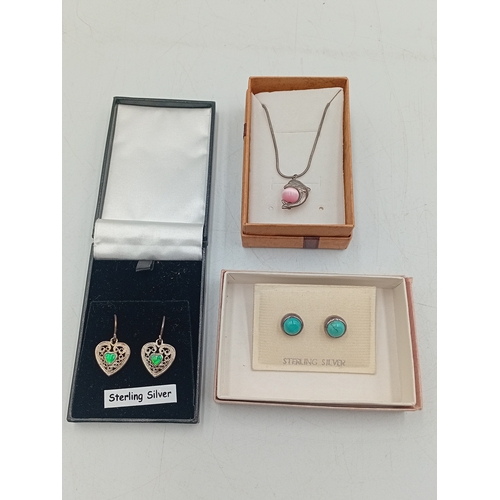 389 - Two pairs of silver earrings and a Claires accessories dolphin necklace with a pink stone.