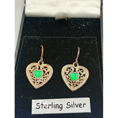 389 - Two pairs of silver earrings and a Claires accessories dolphin necklace with a pink stone.