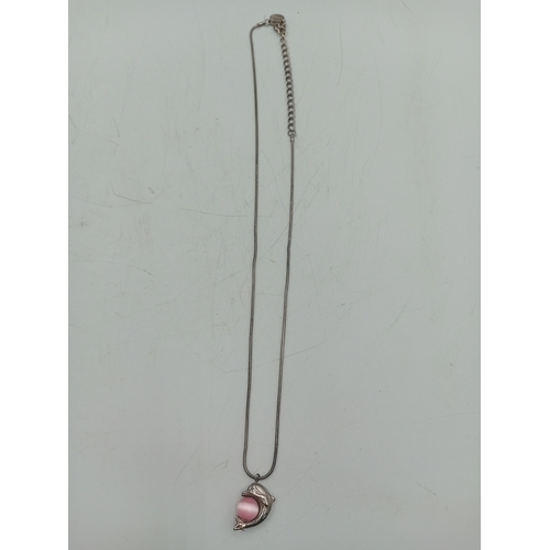 389 - Two pairs of silver earrings and a Claires accessories dolphin necklace with a pink stone.