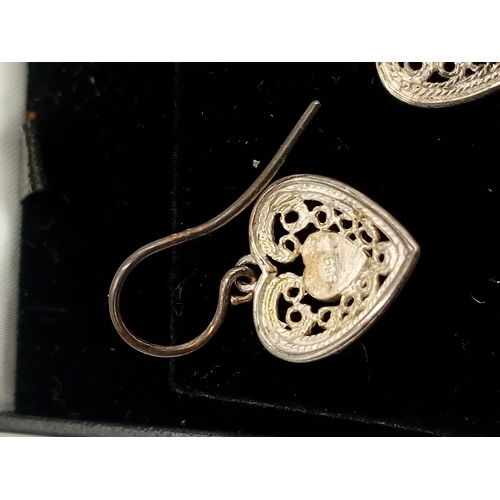 389 - Two pairs of silver earrings and a Claires accessories dolphin necklace with a pink stone.