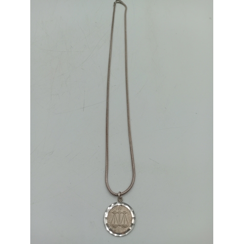 390 - A collection of three silver necklaces. To include; a stamped 925 silver necklace with a stamped sil... 