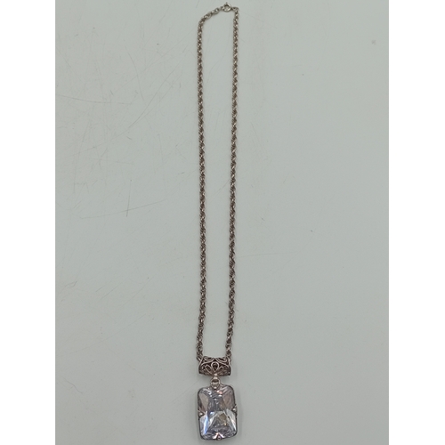 390 - A collection of three silver necklaces. To include; a stamped 925 silver necklace with a stamped sil... 