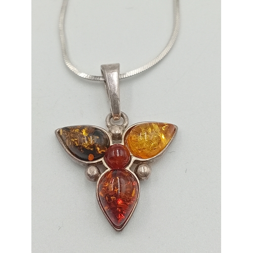 391 - Two stamped 925 silver neckslces. One has a 925 silver pendant set with amber and the other is a sta... 