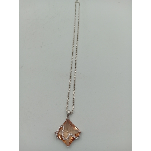 391 - Two stamped 925 silver neckslces. One has a 925 silver pendant set with amber and the other is a sta... 