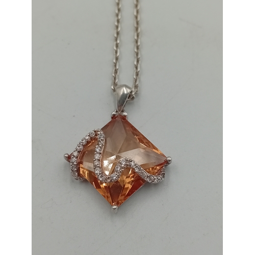 391 - Two stamped 925 silver neckslces. One has a 925 silver pendant set with amber and the other is a sta... 