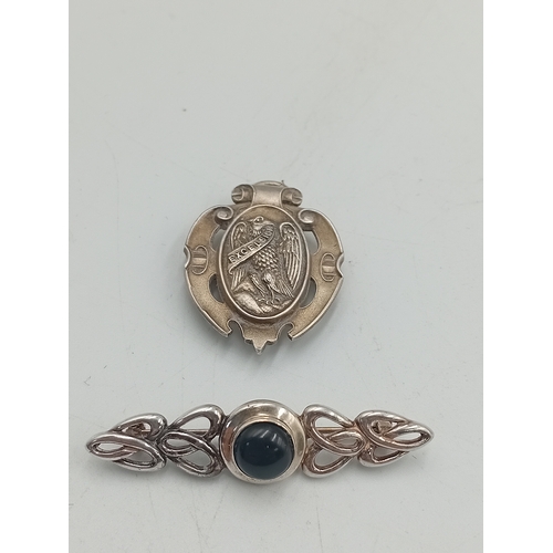 392 - A stamped 925 silver celtic style brooch and a stamped silver HND Excelsiot badge / pendant