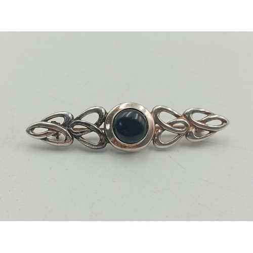 392 - A stamped 925 silver celtic style brooch and a stamped silver HND Excelsiot badge / pendant