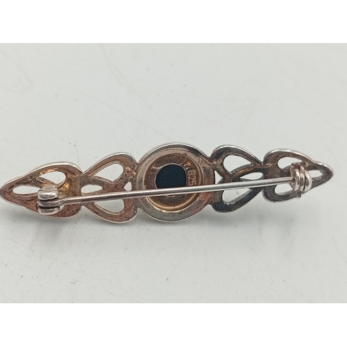 392 - A stamped 925 silver celtic style brooch and a stamped silver HND Excelsiot badge / pendant