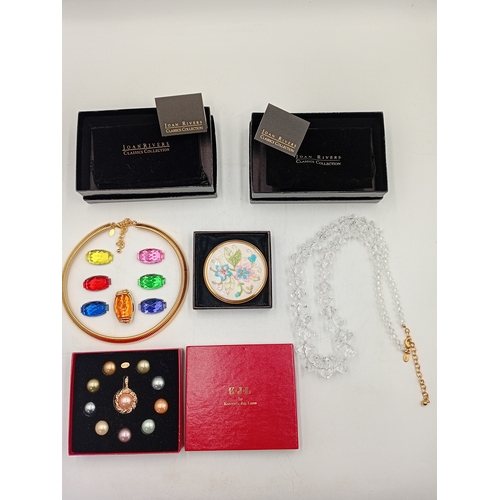 394 - A collection of costume jewellery. To include; two Joan rivers necklaces one has interchangeable gem... 