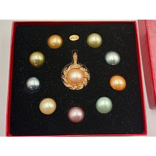 394 - A collection of costume jewellery. To include; two Joan rivers necklaces one has interchangeable gem... 