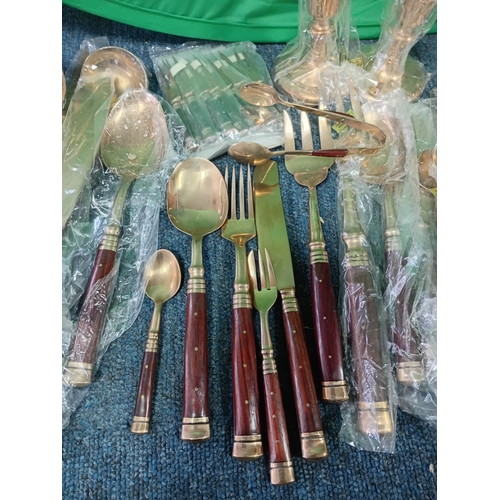 149 - A collection of vintage cutlery still in packaging.