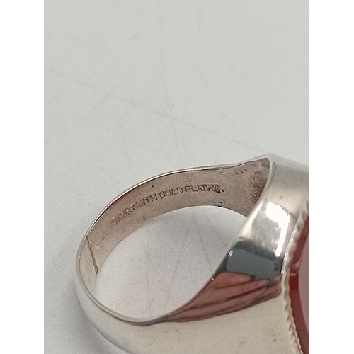 398 - A silver signet ring stamped silver with gold plating. Size S