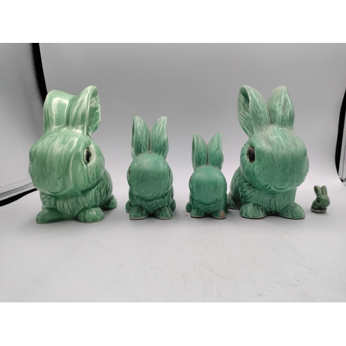 A collection of 5 sylvac green rabbits.