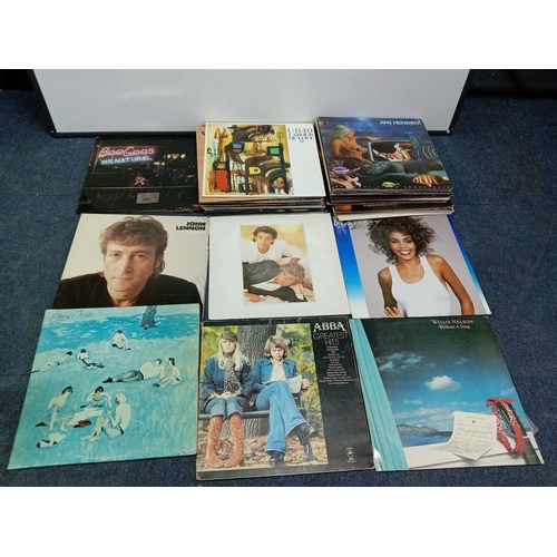 102 - A job lot of Apx 40 vinyl records of various conditions to include wham, Elton John, John Lennon Jim... 