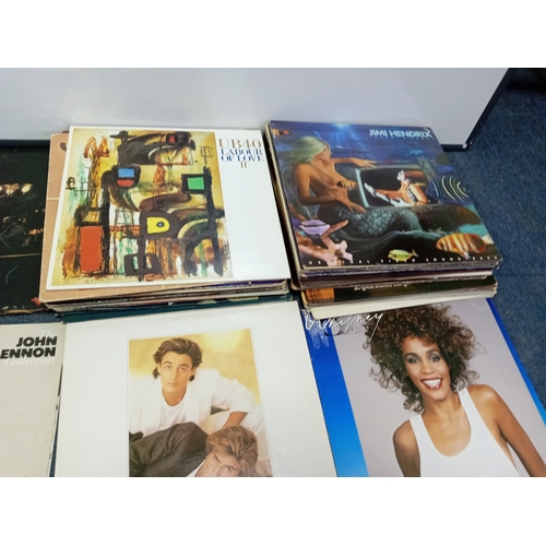 102 - A job lot of Apx 40 vinyl records of various conditions to include wham, Elton John, John Lennon Jim... 