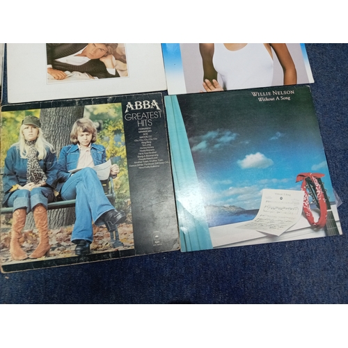 102 - A job lot of Apx 40 vinyl records of various conditions to include wham, Elton John, John Lennon Jim... 