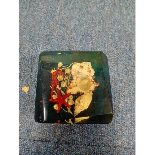 21 - A pair of art glass and a resin paperweight.