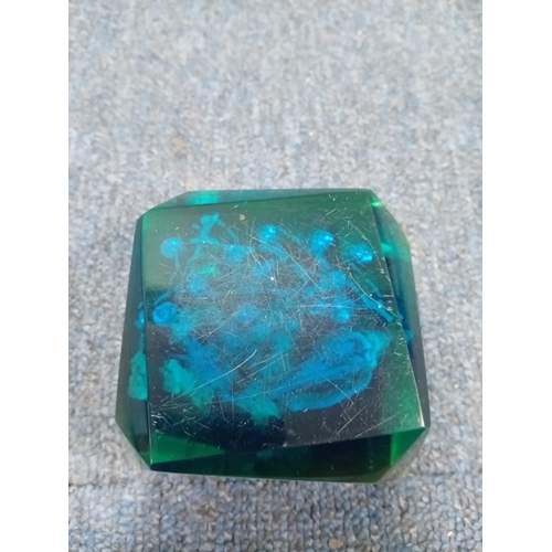 21 - A pair of art glass and a resin paperweight.